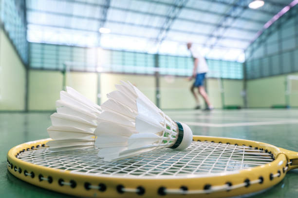 istock Close up shuttlecock on badminton racket at court 1790909428