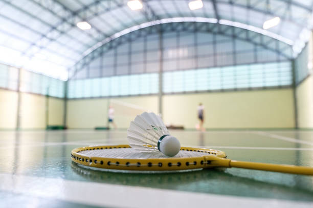 istock Close up shuttlecock on badminton racket at court 1790909453