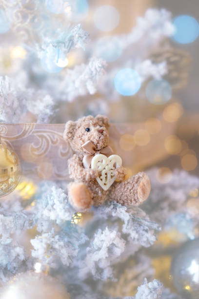 istock Christmas tree background with bear toy and heart 1790912182