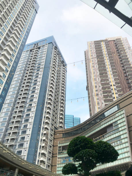 istock Front view of a white modern skyscraper perfect symmetry with blue sky and copy space 1790913885