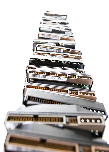 high stack of used hard drives stock photo