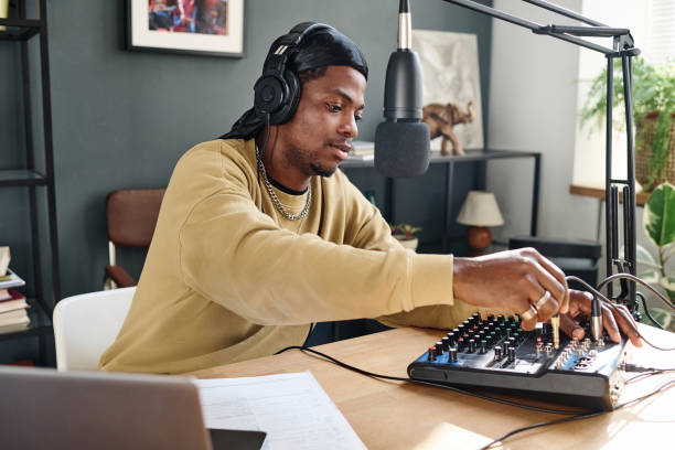 istock African American guy plugging cord into soundboard before adjusting it 1790922033