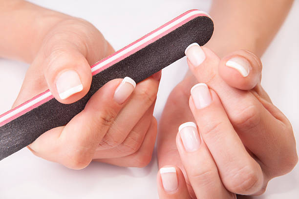 istock woman filing nails 179092292