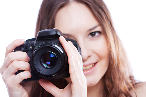 istock smiling woman with professional camera 179092722