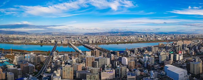 On a sunny day in November 2022, a bridge and iron bridge spanning the Yodogawa River from the Umeda Sky Building in Umeda, Osaka City, Osaka Prefecture.