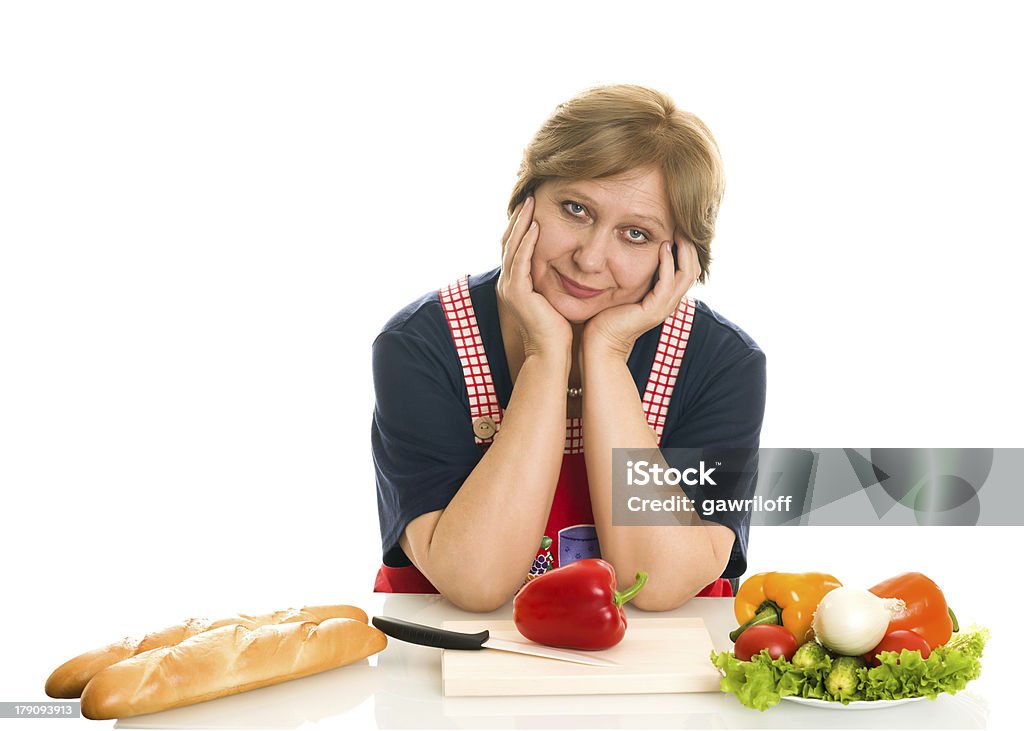 Elderly woman cooks food elderly woman cooks food 50-54 Years Stock Photo