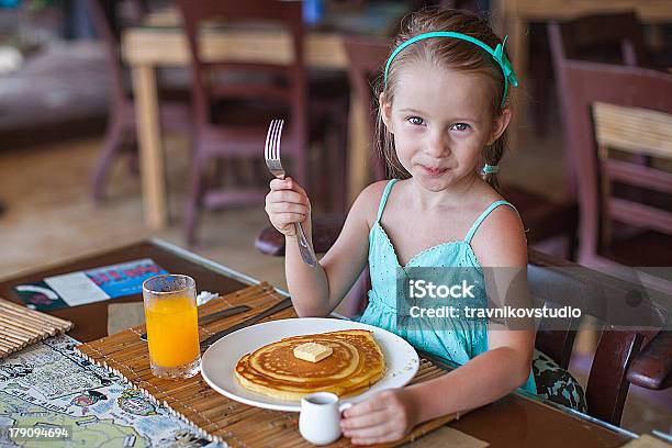 Little Girl Having Breakfast With Juice And Pancake Stock Photo - Download Image Now
