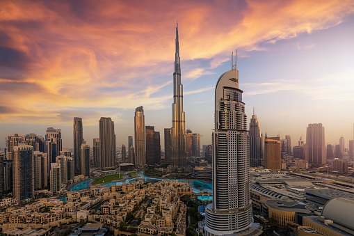 Panoramic sunrise view of the downtown district skyline of Dubai, UAE, with Business Bay Skyscrapers