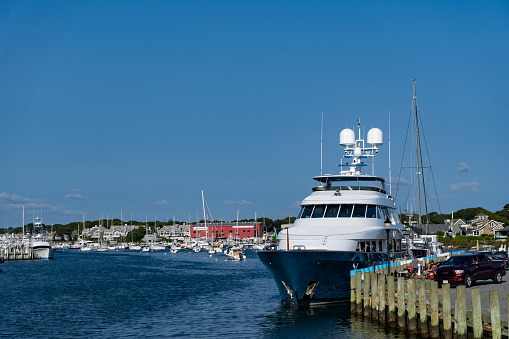 Falmouth harbour on Nantucket Sound.  There are a vast array of yachts and motorboats moored in the marina.