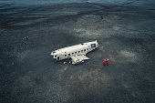 Crashed military DC 3 plane wreck on black sand beach in Iceland