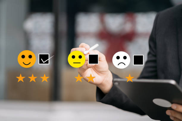 istock Male businessman holding a digital tablet with checkboxes rating smiley faces excellent for Satisfaction Survey, Happy Client Customer Experience concept. 1790996763