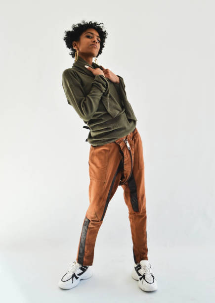 istock Fashion model posing in studio white background 1790998393