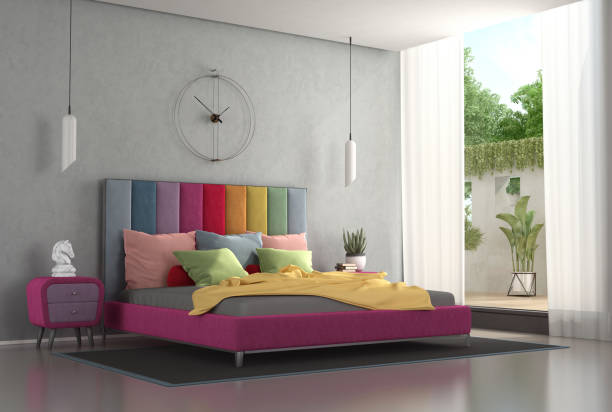 istock Double bed with colorful headboard in a modern bedroom 1791000033