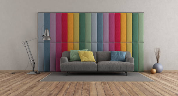 istock Colorful fabric paneling in a modern room with gray sofa 1791000081