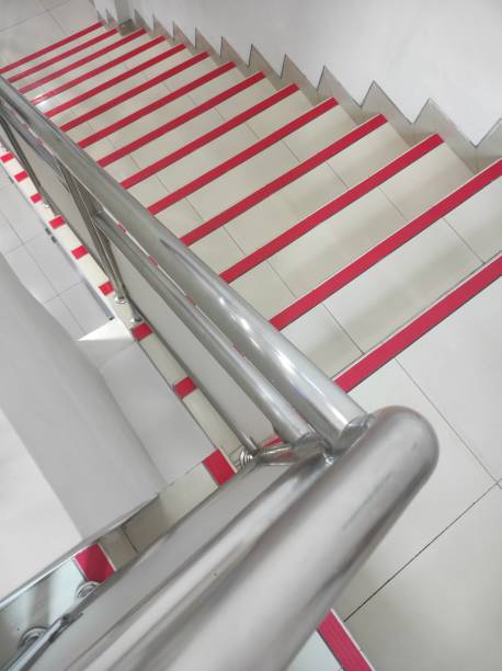istock Building stairs with silver stainless steel and red lines 1791005454