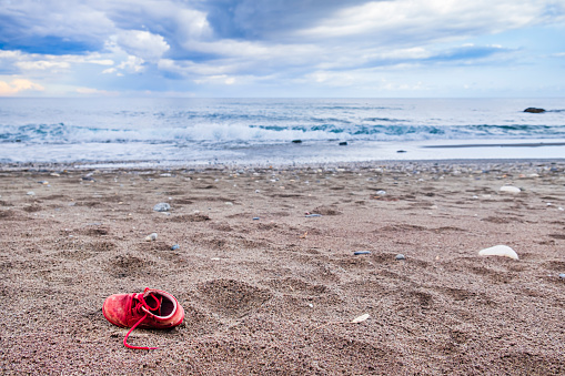 Little boy's red shoe found on the beach