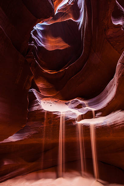 Falling Sand inside Antelope Canyon stock photo