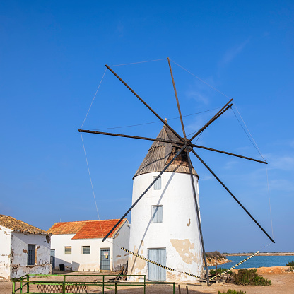 The Quintín windmill is one of the typical features in the Parque Regional de las Salinas of San Pedro del Pinatar, a small town in the Region of Murcia