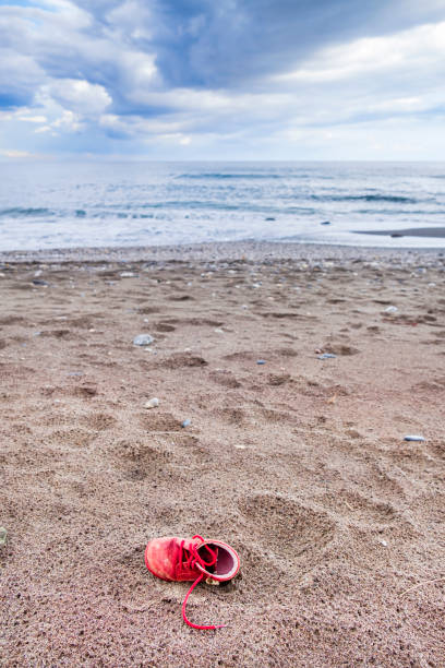 Little boy's red shoe found on the beach