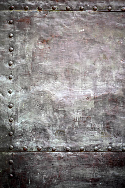 istock Black metal plate or armour texture with rivets 179102845