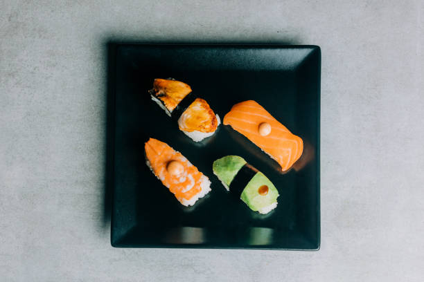 istock traditional sushi with salmon, eel and tuna on black plate 1791033178