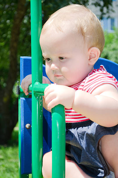 istock little girl on a swing 179103987