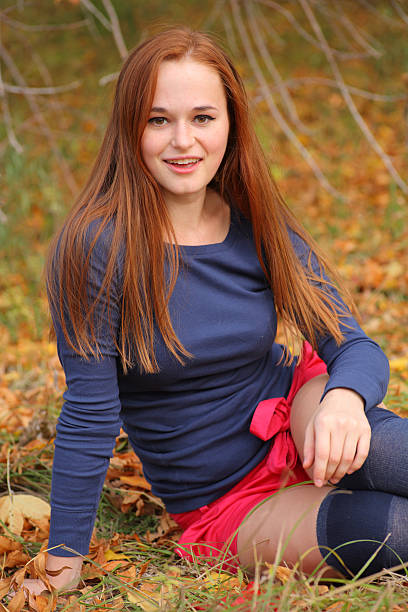 istock Woman sitting in the park 179104161