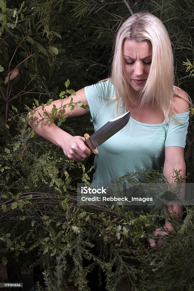 Mujer cortes aunque intensivo casquillos con cuchilla - Foto de stock de Jersey tipo chaleco libre de derechos