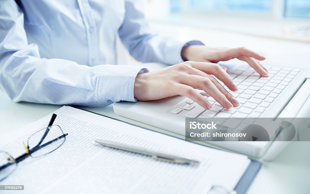 Typing hands Hands of an office woman typing Business Stock Photo
