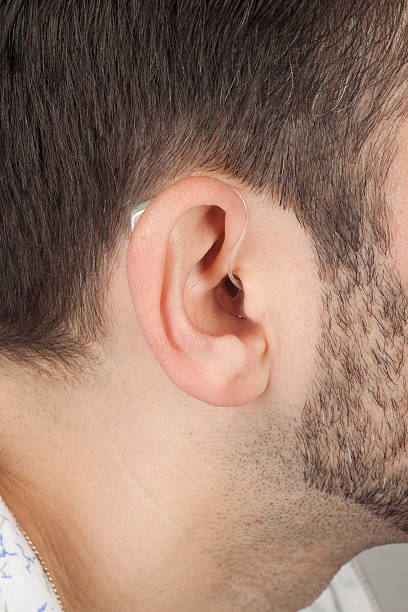 istock ear with acoustic instrument 179105406