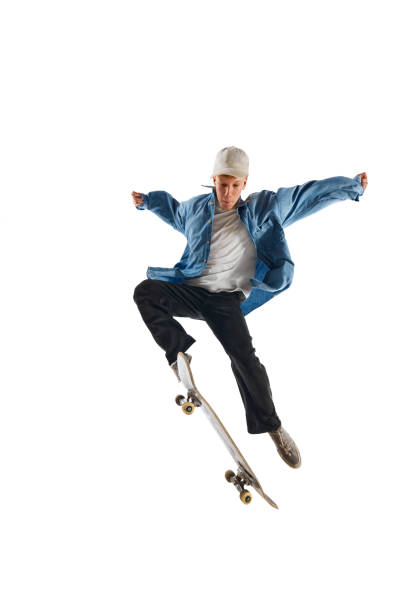 istock Sportive, active young man in casual clothes in motion, training with skateboard, doing stunts isolated over white background 1791060133
