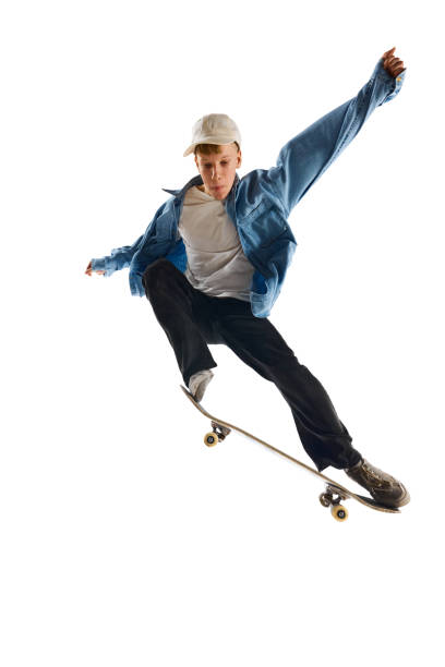 istock Teen boy, active guy in casual clothes in motion, training, practicing stunts on skateboard isolated over white background 1791060155