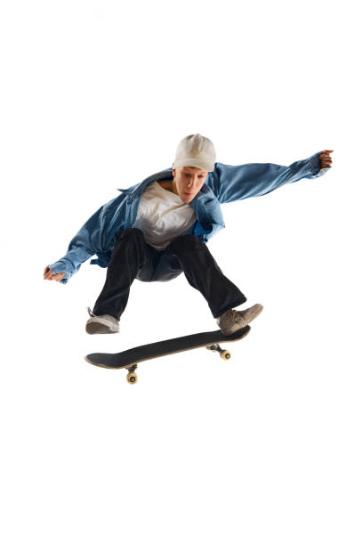 istock Teen boy, active guy in casual clothes in motion, training, practicing stunts on skateboard isolated over white background 1791060156