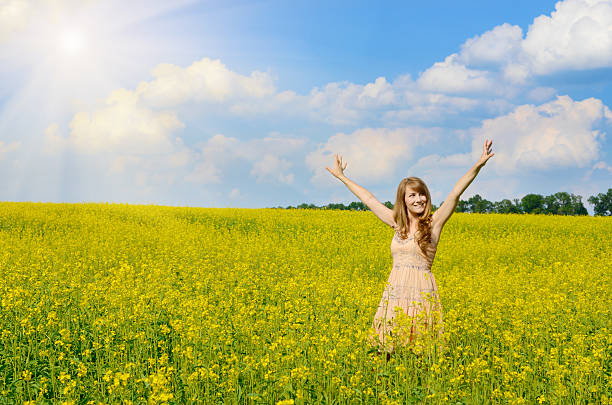 istock Young woman at canola field 179106623