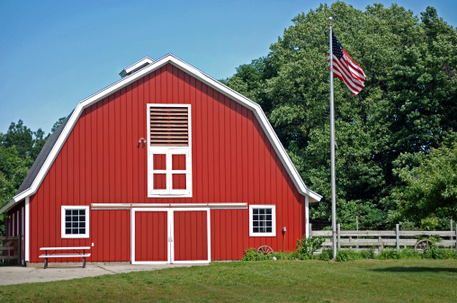 Bright red barn with American flag.