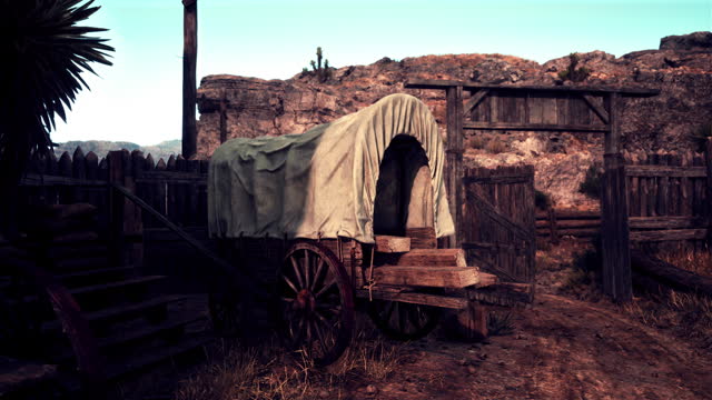 An authentic western town with a rustic covered wagon