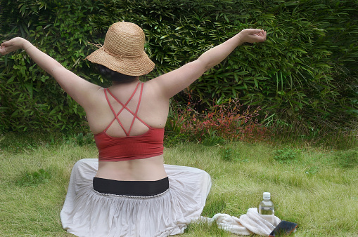 Woman Doing Yoga on the Lawn