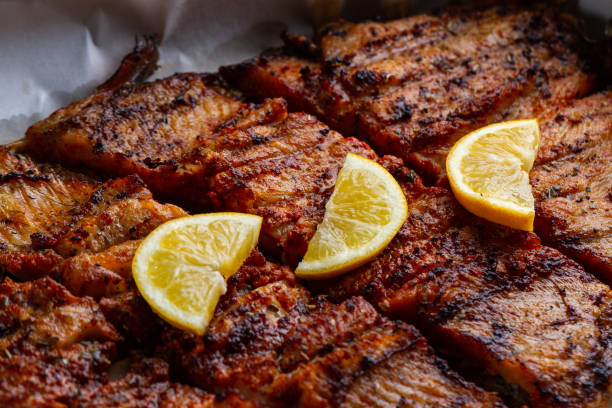 Fresh fish grilled texture. Grilled salmon with a slice of juicy lemon