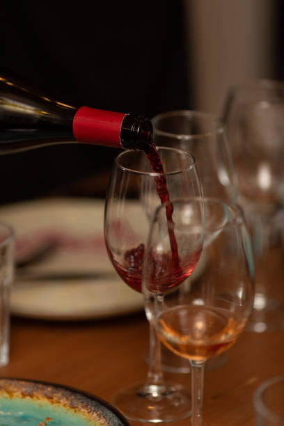 istock Sommelier pours red wine into a glass during tasting 1791088286