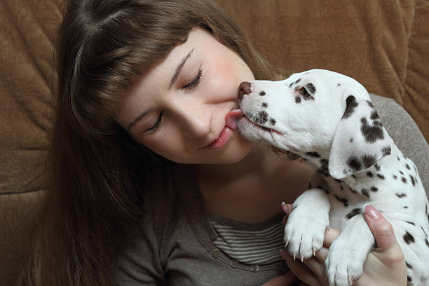 istock Girl and puppy 179109360