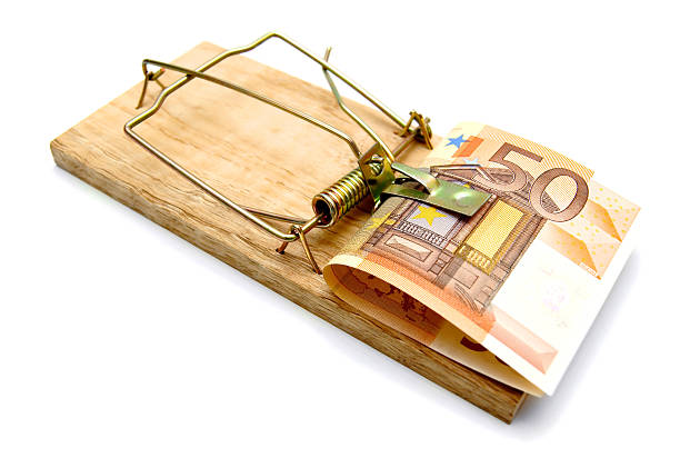 istock Mousetrap and money on a white background. 179109608