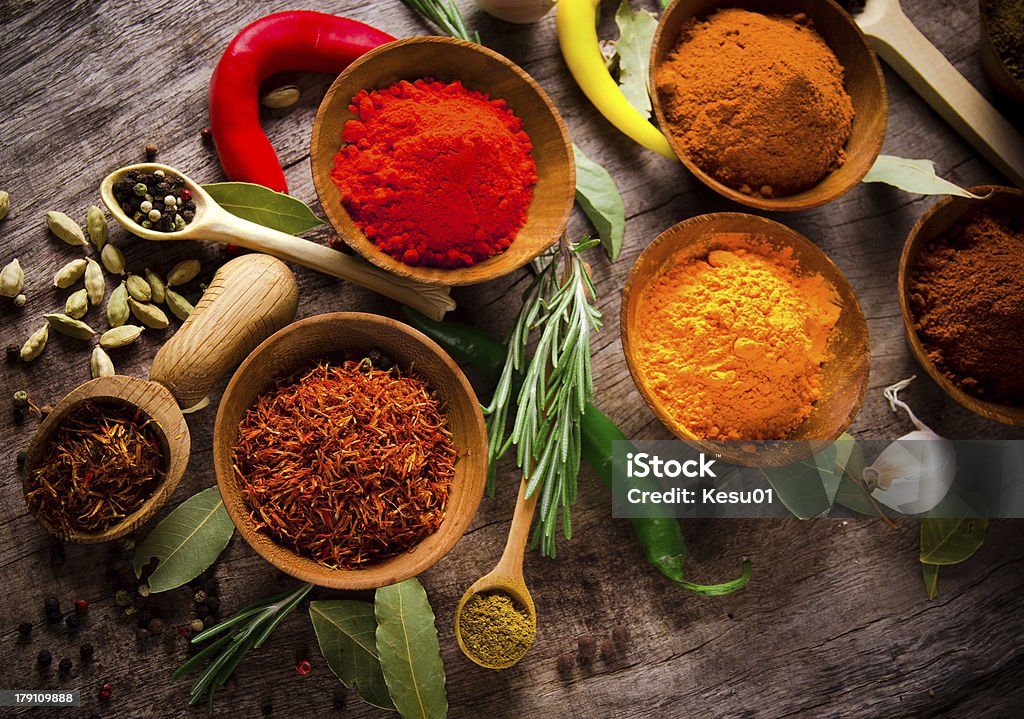 Assorted spices Assorted spices on wooden table Allspice Stock Photo