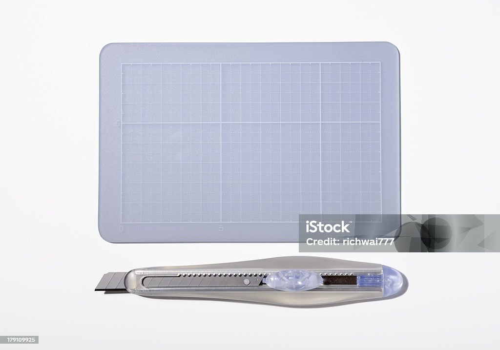 Cutter and Cutting mat A set of white cutter and cutting mat isloated in white background with clipping path included. Art and Craft Equipment Stock Photo