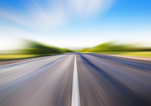driving at high speed in empty road motion blur