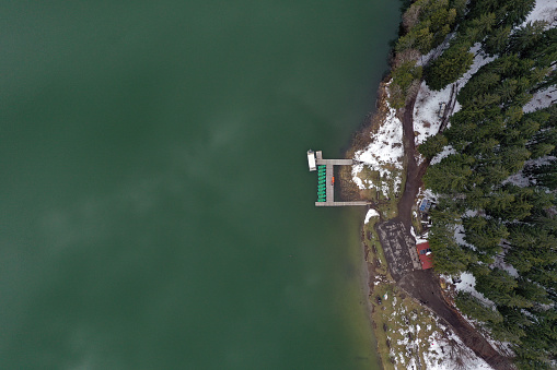 Aerial drone view of a lake boat dock. Flying above a vessel pier