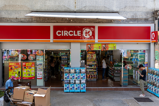 Hong Kong - November 12, 2023 : People at the Circle K convenience store in Tuen Mun, New Territories, Hong Kong. It is an international chain of convenience stores.