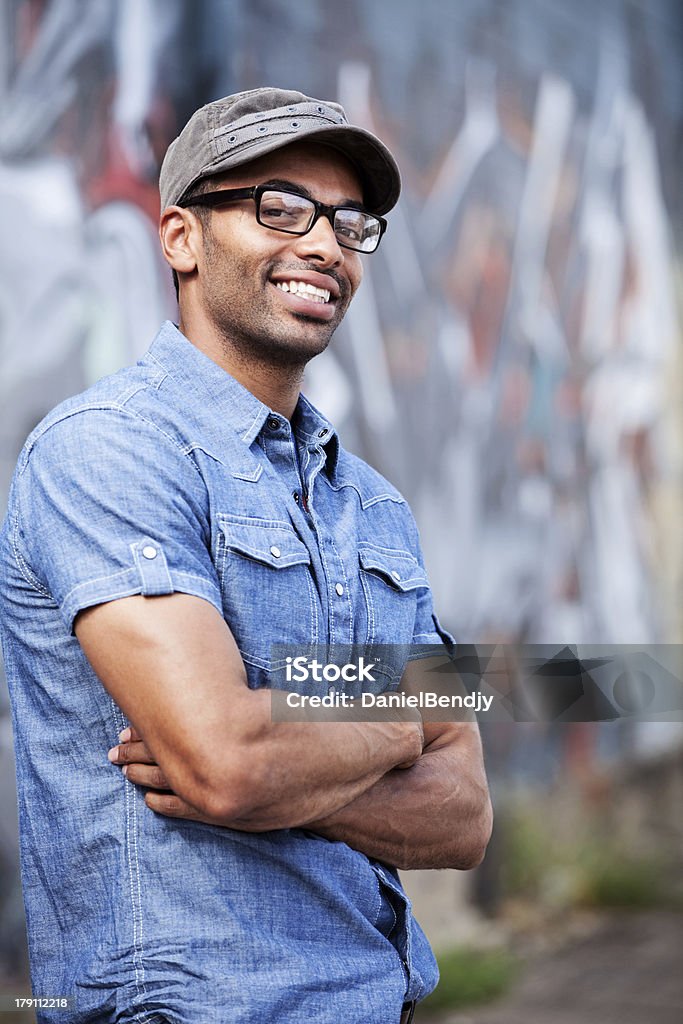 Mixed Race Young Urbanite Young man of mixed race in an urban environment. 20-24 Years Stock Photo