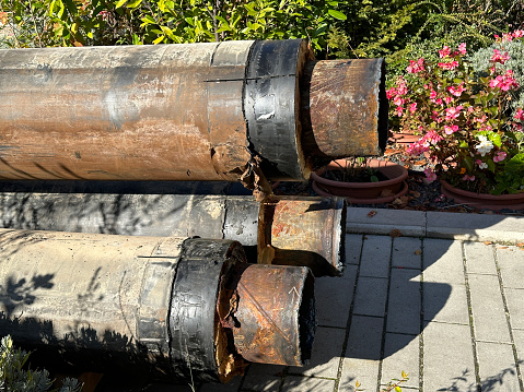 Old rusty metal pipes on the street