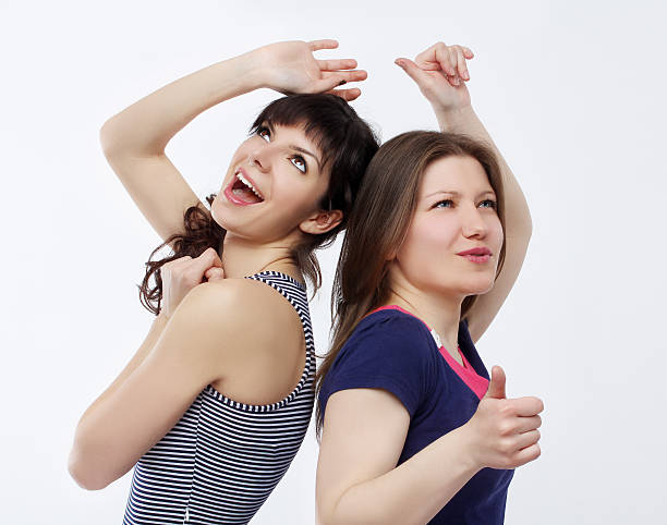istock Two female friends dancing  and singing 179112412