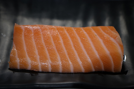Salmon is the common name for several species of fish in the Salmonidae family, which also includes trout, typical of the cold waters of northern Eurasia and America.